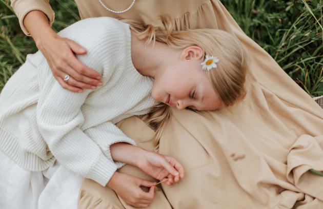 Mother comforting young girl for early or delayed puberty care in Dubai